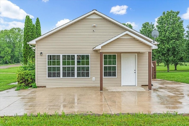 205 Jackson St, Cowan, TN 37318 - back of property featuring a lawn and a patio area