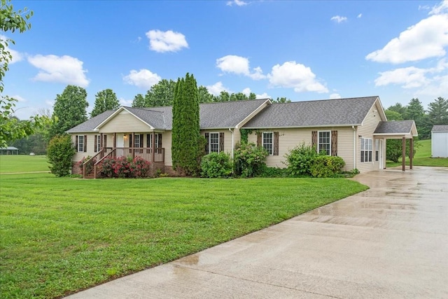 205 Jackson St, Cowan, TN 37318 - single story home featuring concrete driveway, covered porch, a front yard, and a shingled roof