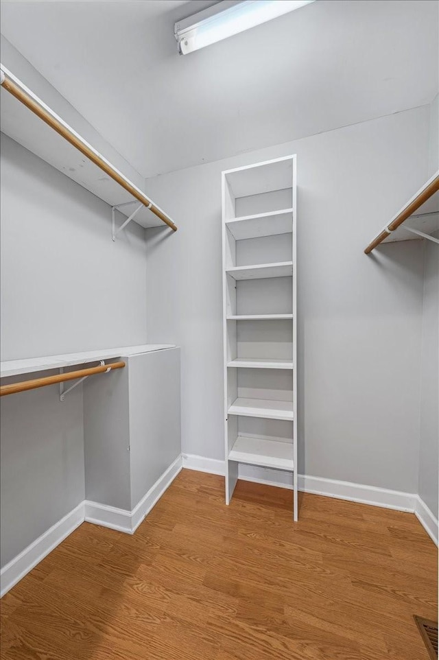 205 Jackson St, Cowan, TN 37318 - spacious closet featuring wood finished floors