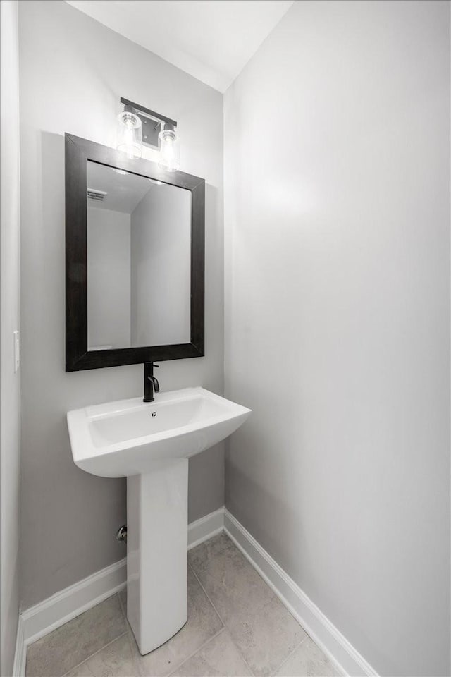 205 Jackson St, Cowan, TN 37318 - bathroom with baseboards and tile patterned flooring