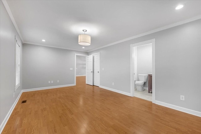 205 Jackson St, Cowan, TN 37318 - unfurnished bedroom with ornamental molding, baseboards, recessed lighting, wood finished floors, and connected bathroom