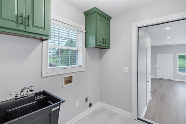 205 Jackson St, Cowan, TN 37318 - laundry room with electric dryer hookup, cabinet space, washer hookup, and baseboards