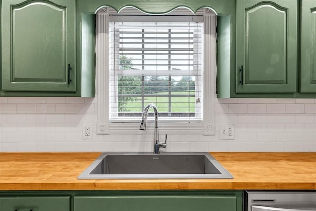 205 Jackson St, Cowan, TN 37318 - kitchen featuring green cabinets, a sink, wood counters, and stainless steel dishwasher