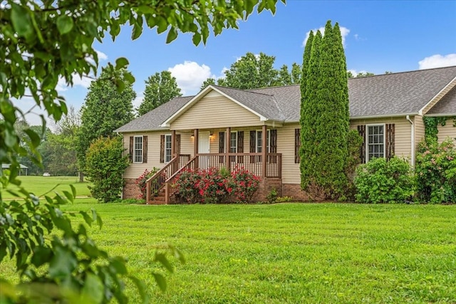 205 Jackson St, Cowan, TN 37318 - single story home with covered porch, a front lawn, and roof with shingles