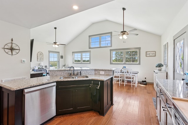 706 Kirbytown Rd, Lafayette, TN 37083 - kitchen featuring dishwashing machine, a ceiling fan, a sink, healthy amount of natural light, and high vaulted ceiling