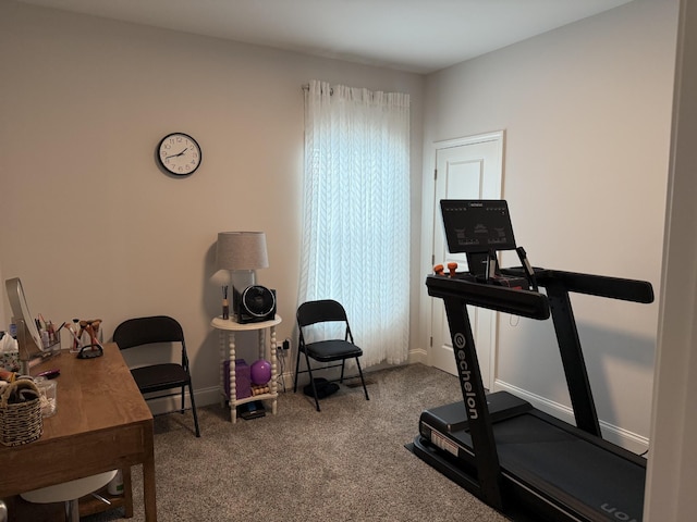 workout room with carpet floors and baseboards