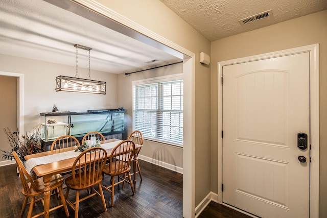 1461 Round Rock Dr, Murfreesboro, TN 37128 - dining room with dark wood-style flooring, baseboards, and a textured ceiling