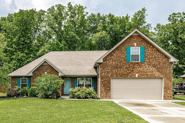 1461 Round Rock Dr, Murfreesboro, TN 37128 - view of front facade featuring brick siding, roof with shingles, concrete driveway, a front yard, and a garage