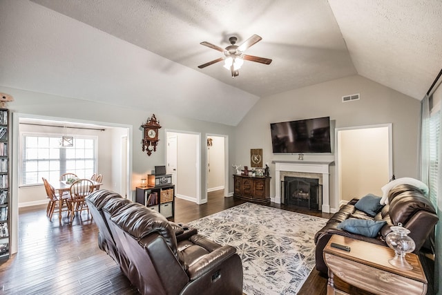 1461 Round Rock Dr, Murfreesboro, TN 37128 - living room with a ceiling fan, vaulted ceiling, dark wood-type flooring, baseboards, and a fireplace