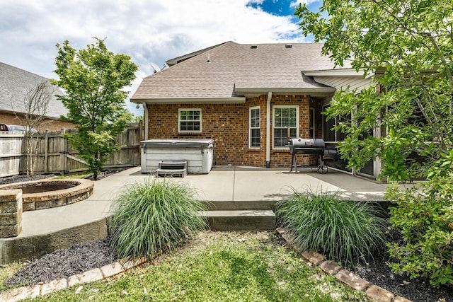 1461 Round Rock Dr, Murfreesboro, TN 37128 - rear view of house with a patio, fence, brick siding, and roof with shingles