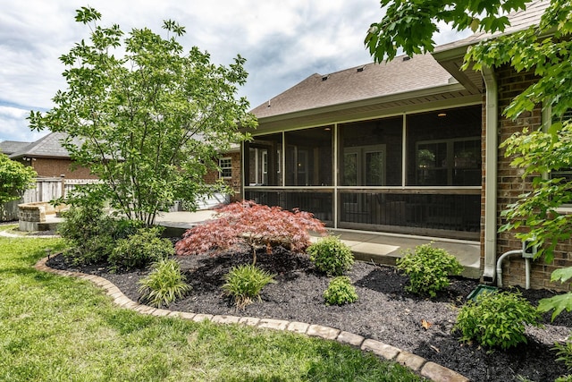 1461 Round Rock Dr, Murfreesboro, TN 37128 - rear view of property featuring a sunroom, brick siding, a patio, and a shingled roof