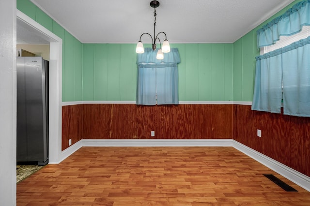 4756 Old Tullahoma Rd, Winchester, TN 37398 - unfurnished dining area featuring wood finished floors, baseboards, and a textured ceiling