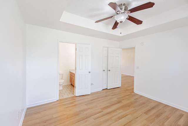 7004 Westfork Dr, Smyrna, TN 37167 - unfurnished bedroom featuring light wood-type flooring, baseboards, and ensuite bathroom