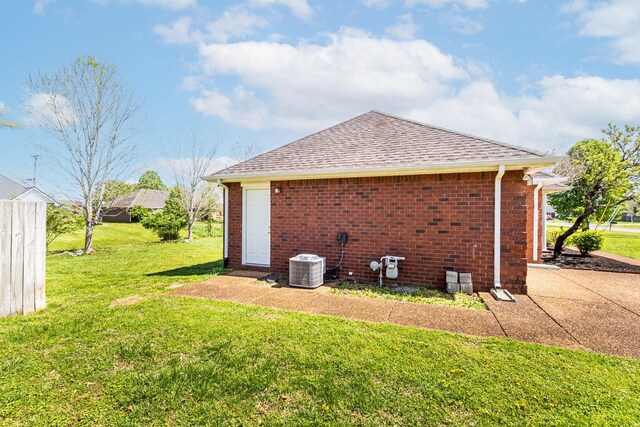 7004 Westfork Dr, Smyrna, TN 37167 - view of property exterior with a yard, roof with shingles, brick siding, and central air condition unit