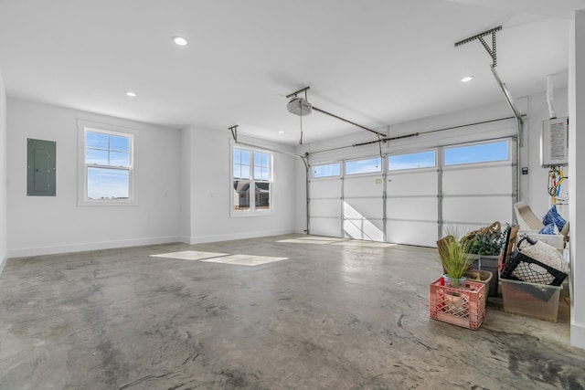 4455 Knox Ln, Cookeville, TN 38506 - garage with electric panel, a garage door opener, recessed lighting, and baseboards