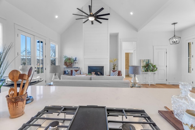 4455 Knox Ln, Cookeville, TN 38506 - kitchen with high vaulted ceiling, a ceiling fan, recessed lighting, a large fireplace, and pendant lighting