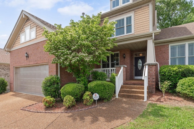 3045 Cairns Dr W, Mount Juliet, TN 37122 - view of front of house featuring covered porch, brick siding, a garage, and concrete driveway