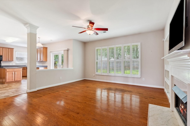 3045 Cairns Dr W, Mount Juliet, TN 37122 - unfurnished living room with a premium fireplace, healthy amount of natural light, and light wood-style flooring