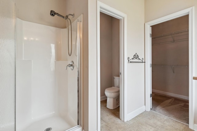 3045 Cairns Dr W, Mount Juliet, TN 37122 - full bath with a stall shower, toilet, a walk in closet, and baseboards