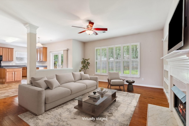 3045 Cairns Dr W, Mount Juliet, TN 37122 - living area featuring a high end fireplace, wood finished floors, a ceiling fan, and baseboards