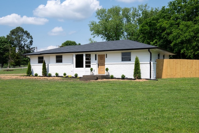 single story home featuring brick siding