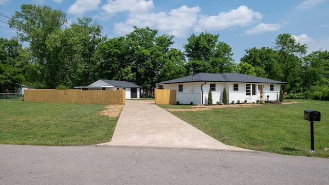 view of front facade featuring concrete driveway and brick siding