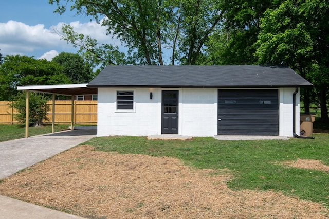 garage with concrete driveway and a carport