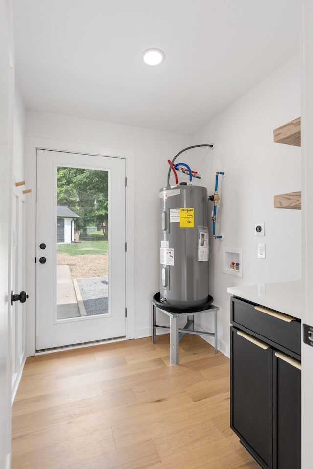 utility room featuring electric water heater