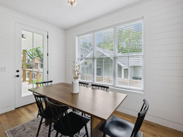 dining area with wood finished floors