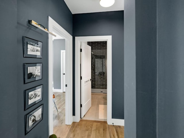 corridor with light wood finished floors