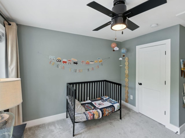 bedroom with carpet floors, baseboards, and a ceiling fan
