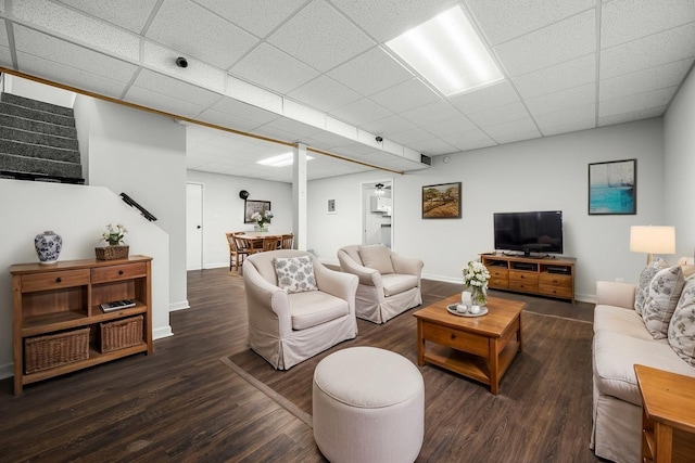 124 Tom Link Rd, Cottontown, TN 37048 - living area featuring wood finished floors, stairway, a drop ceiling, and baseboards