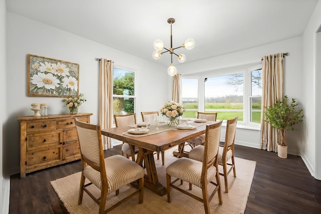 124 Tom Link Rd, Cottontown, TN 37048 - dining room featuring dark wood-type flooring, a chandelier, and baseboards