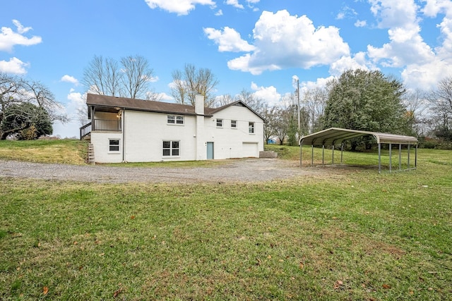 124 Tom Link Rd, Cottontown, TN 37048 - back of property with a yard, a chimney, a detached carport, and gravel driveway