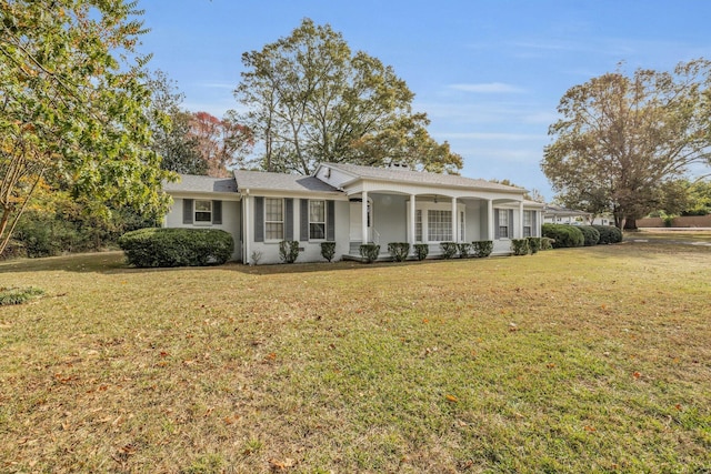 519 S Scott St, Scottsboro, AL 35768 - ranch-style house featuring a porch, a front yard, and stucco siding