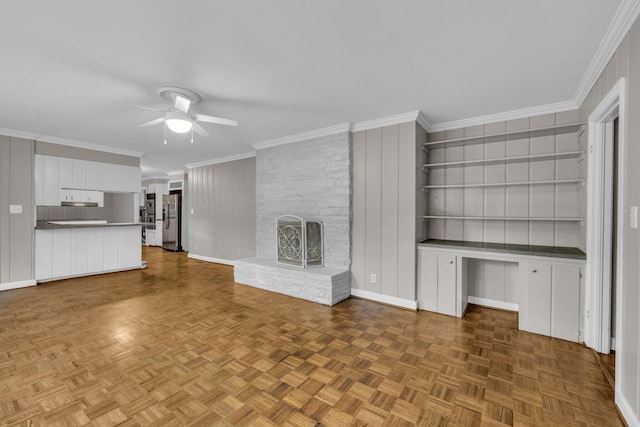 519 S Scott St, Scottsboro, AL 35768 - unfurnished living room with ceiling fan, a fireplace, and ornamental molding