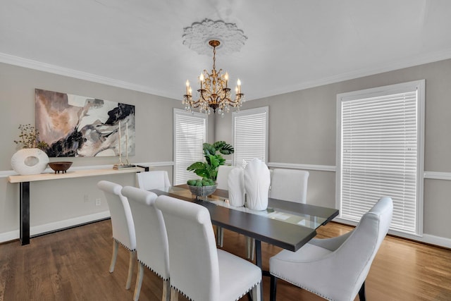 519 S Scott St, Scottsboro, AL 35768 - dining room featuring a chandelier, crown molding, wood finished floors, and baseboards
