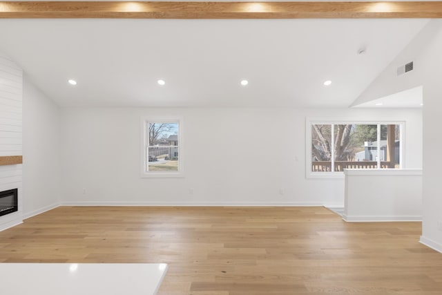208 Roberta Dr, Hendersonville, TN 37075 - unfurnished living room with healthy amount of natural light, a large fireplace, light wood finished floors, recessed lighting, and baseboards
