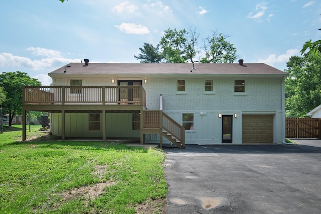 208 Roberta Dr, Hendersonville, TN 37075 - rear view of property featuring brick siding, driveway, a wooden deck, stairs, and a garage