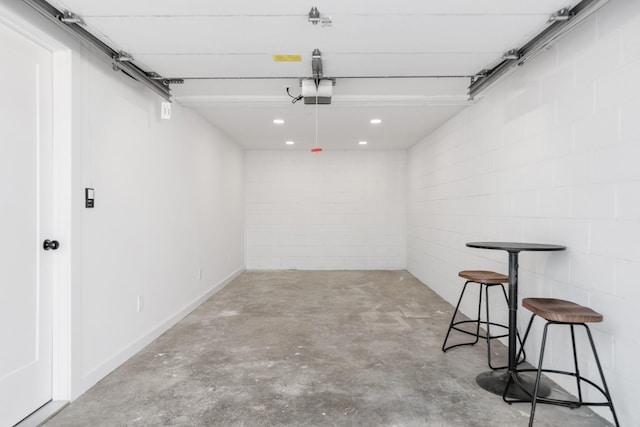 208 Roberta Dr, Hendersonville, TN 37075 - garage featuring concrete block wall, a garage door opener, recessed lighting, and baseboards