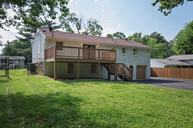 208 Roberta Dr, Hendersonville, TN 37075 - back of house with driveway, brick siding, a wooden deck, and stairway
