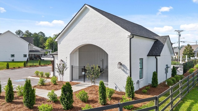 3983 Inlet Loop, Chattanooga, TN 37416 - view of side of property with brick siding, roof with shingles, and uncovered parking