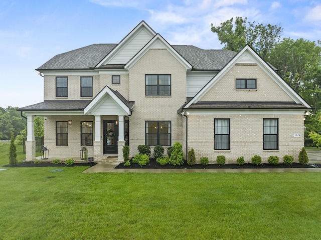 3224 Chase Point Dr, Franklin, TN 37067 - view of front of house with brick siding, a front yard, a shingled roof, and covered porch