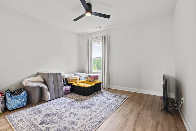 3224 Chase Point Dr, Franklin, TN 37067 - living area featuring wood finished floors, a ceiling fan, and baseboards