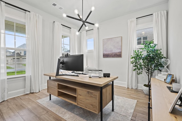 3224 Chase Point Dr, Franklin, TN 37067 - office space featuring light wood-type flooring, a chandelier, and baseboards