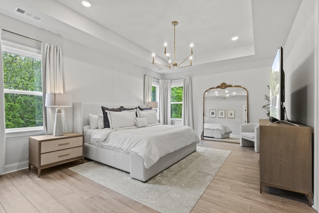 3224 Chase Point Dr, Franklin, TN 37067 - bedroom featuring a chandelier, a tray ceiling, light wood finished floors, and recessed lighting