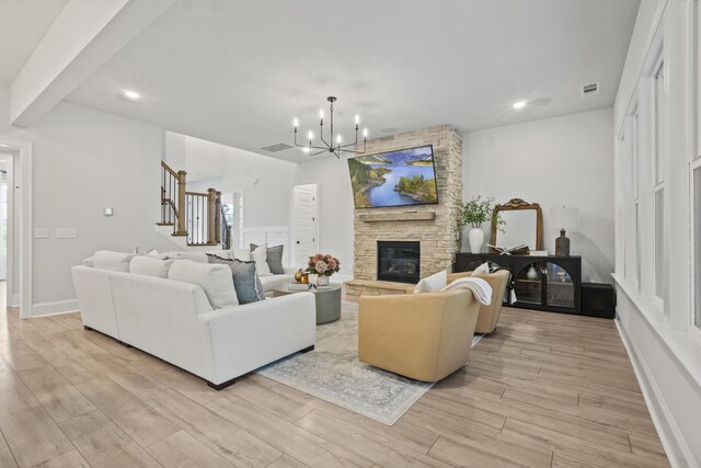 3224 Chase Point Dr, Franklin, TN 37067 - living room with stairs, light wood-style flooring, a chandelier, a fireplace, and recessed lighting