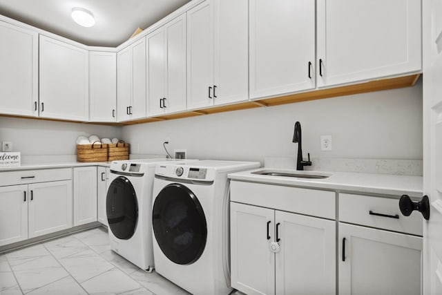 3224 Chase Point Dr, Franklin, TN 37067 - laundry area featuring washer and clothes dryer, light marble finish floors, and cabinet space