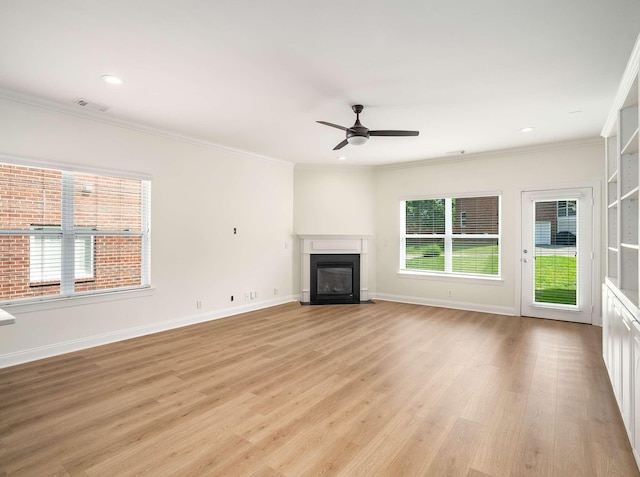 3038 Oxford Glen Dr, Franklin, TN 37067 - unfurnished living room featuring a fireplace with flush hearth, crown molding, a ceiling fan, light wood-style floors, and baseboards