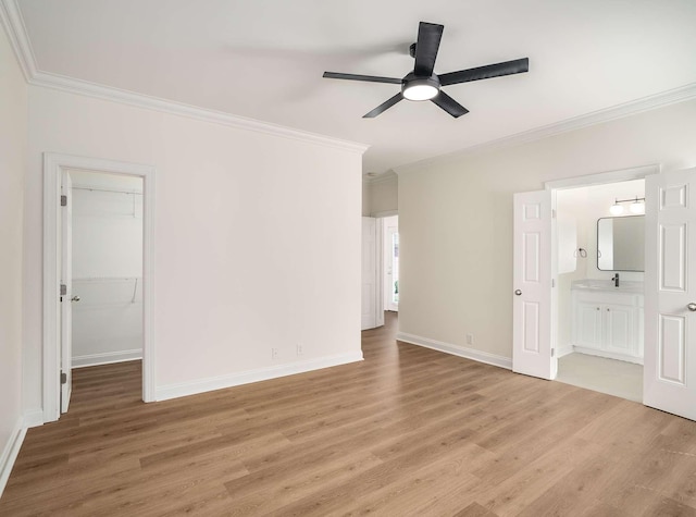 3038 Oxford Glen Dr, Franklin, TN 37067 - empty room featuring ornamental molding, light wood-style flooring, a ceiling fan, baseboards, and a sink